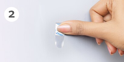 Command™ clear hooks instructions step 2- apply strip to wall and press for 30 seconds
