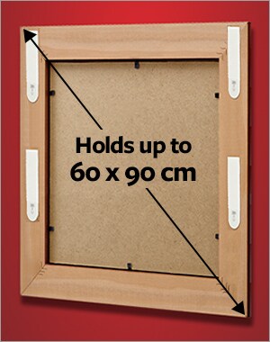 A frame holding a maximum size of 60x90cm using 4 sets of Large picture hanging strips.