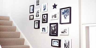 organic gallery wall inspiration used along stairway
