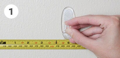 Command™ Clear Medium Hook placed on the wall
