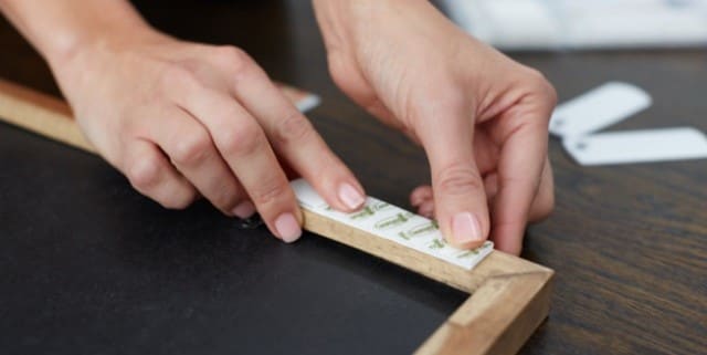 mirror and artworks displayed with command picture hanging strips