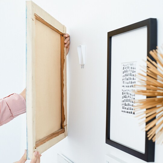 hanging a frame using Command™  Picture Hanging Strips