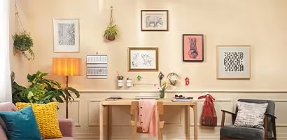 picture frames and artworks displayed using command wall hanging hooks
