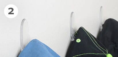 Baseball cap holder using Command™ Clear Medium Hooks
