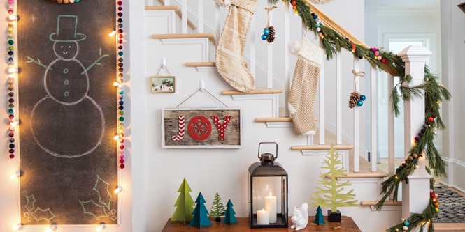 Hanging Christmas decorations by the stairway
