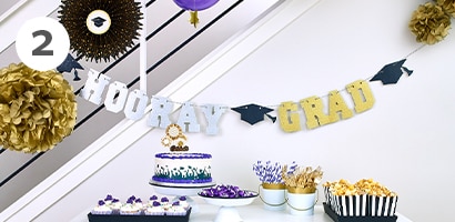 Hanging garlands as a graduation backdrop
