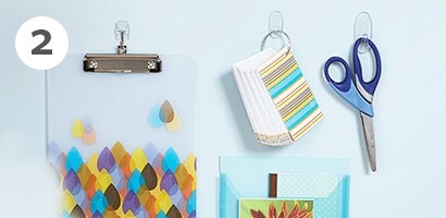Command hooks as wall hanging solutions for home office room
