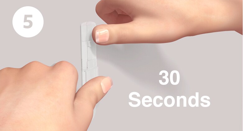 Step 5 of applying Command™ hooks: press base firmly for 30 seconds
