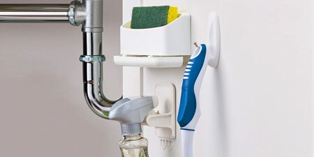 image of a command sponge caddy hung on the kitchen wall