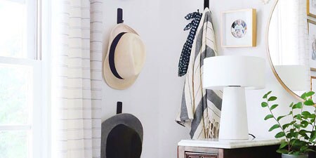 image of using command brand products to hang items like hats and clothing at home