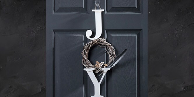 Cutout letters decorating the door for Christmas
