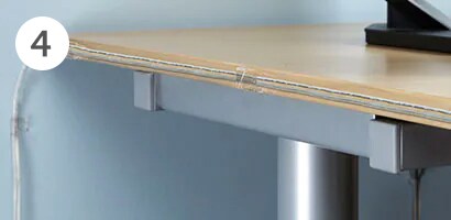 Cords organised on the desk in a home office 
